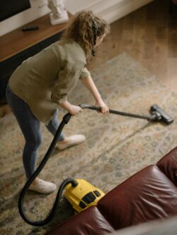 person cleaning carpet